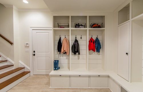 Finished basement with custom built-ins for mudroom.
