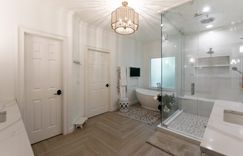 Master bathroom and Custom closet:  Custom cabinetry, quartz countertops, large steam shower, jetted freestanding tub