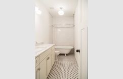 Master bathroom white cabinets and tile floor remodel